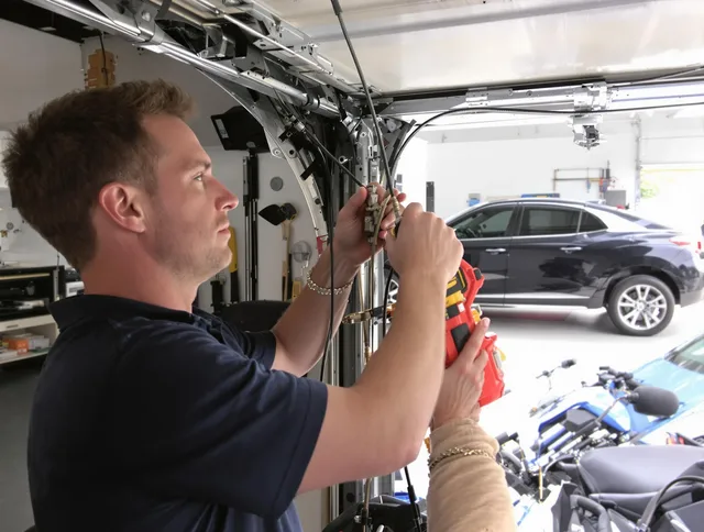 Branford Garage Door Repair safety certified technician performing cable replacement in Branford