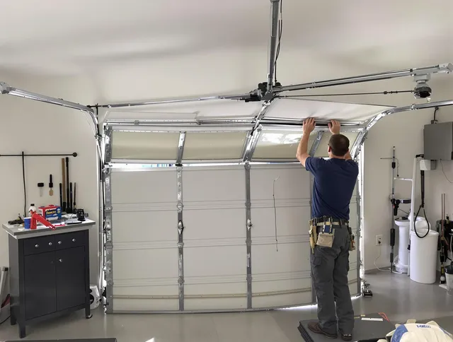 Branford Garage Door Repair specialist performing precise section replacement on Branford garage door